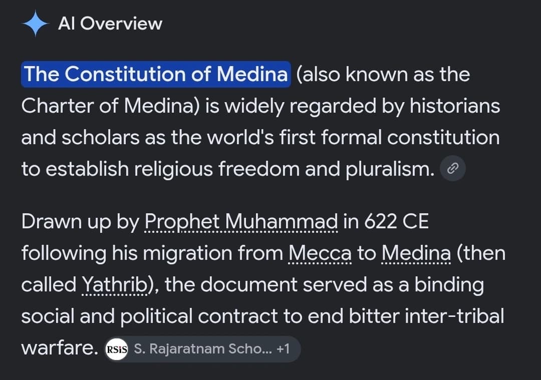 AI description: A screenshot of an AI Overview says the “Constitution of Medina” is “widely regarded by historians and scholars as the world's first formal constitution to establish religious freedom and pluralism.”
